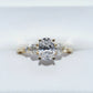 Gold ring with three diamonds on a white background