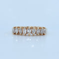 Gold ring with diamonds on a light blue background
