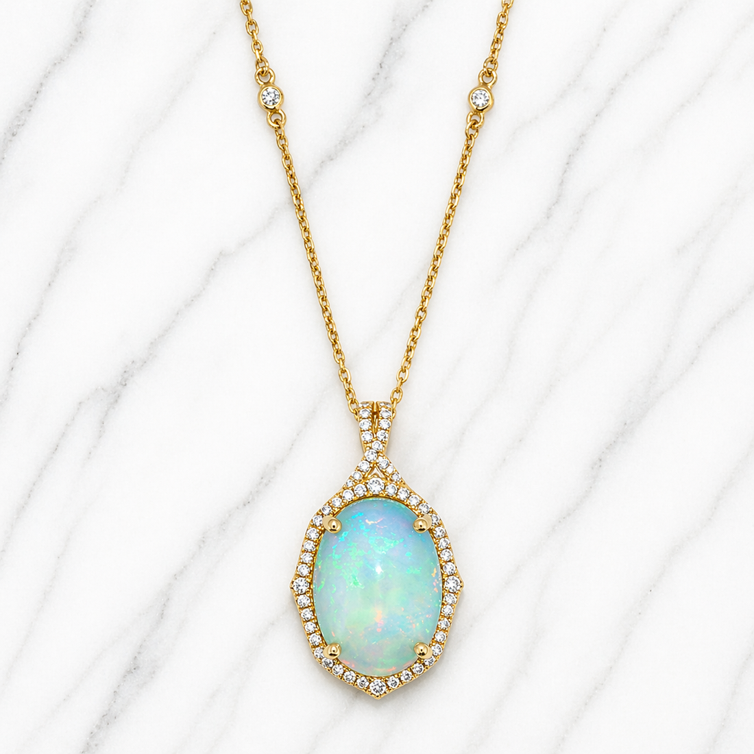 Gold necklace with an opal pendant on a white marble background 14K Gold | Yellow Gold Ethiopian Opal and Natural Diamond Pendant with Necklace Set