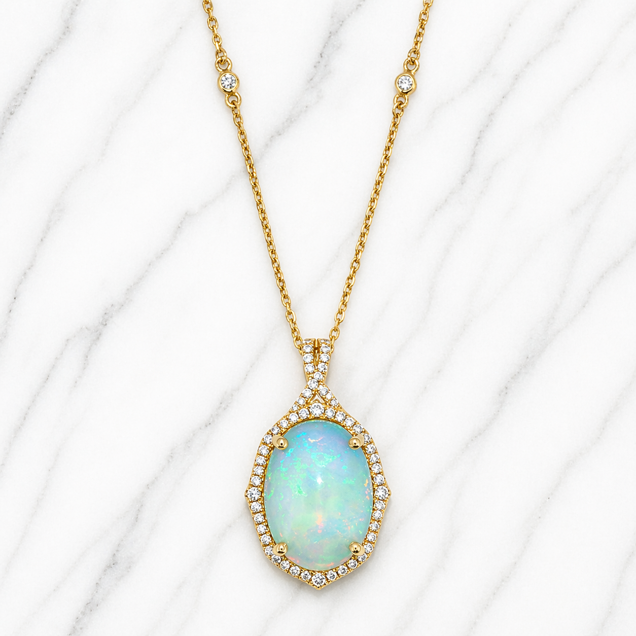 Gold necklace with an opal pendant on a white marble background 14K Gold | Yellow Gold Ethiopian Opal and Natural Diamond Pendant with Necklace Set