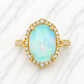 Gold ring with an opal stone and diamond accents on a white  14K Gold | Yellow Gold Ethiopian Opal and Natural Diamond Ring background