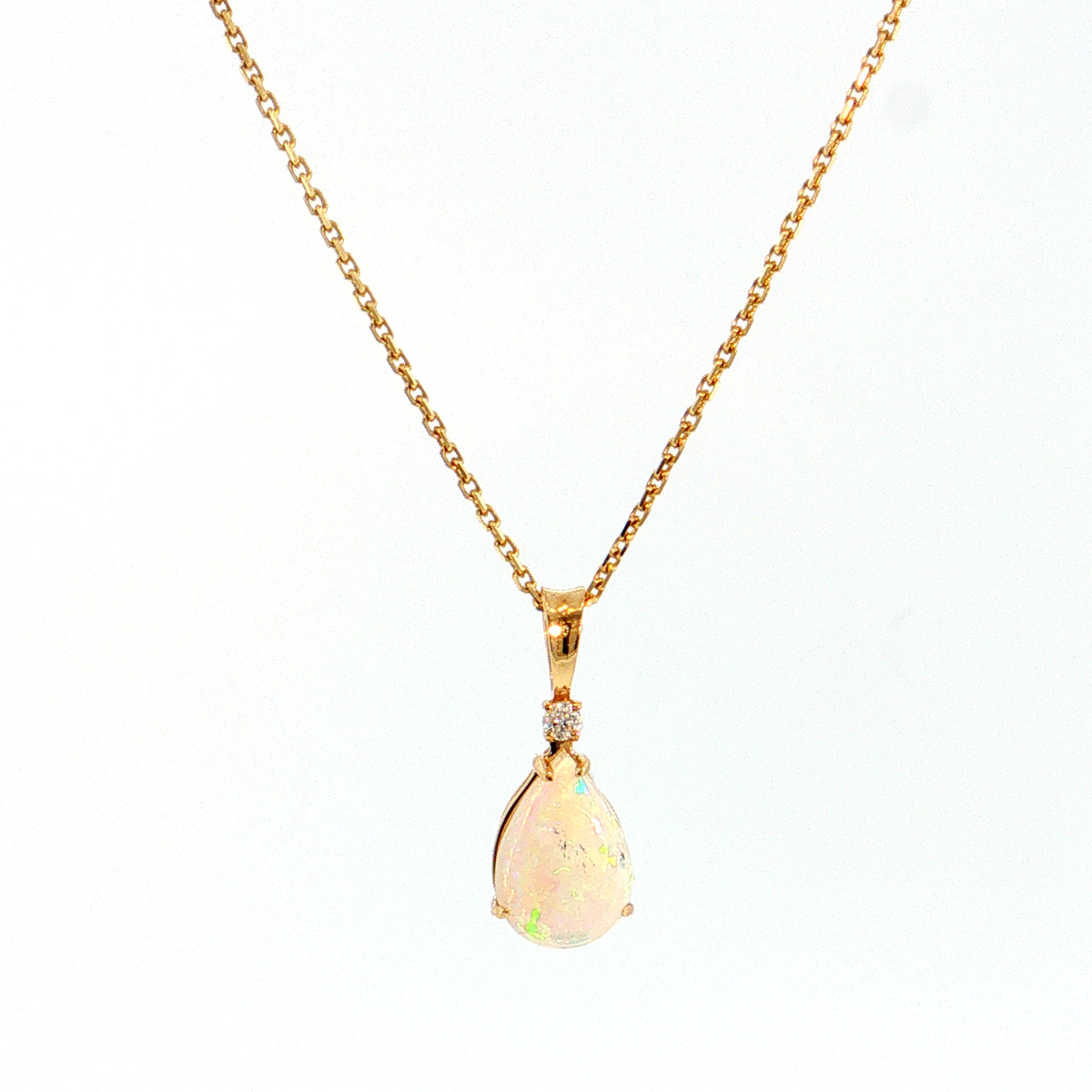 14K Gold | Yellow Gold Pear Shaped 1.05CT Opal Pendant with .03CT Round Natural Diamond