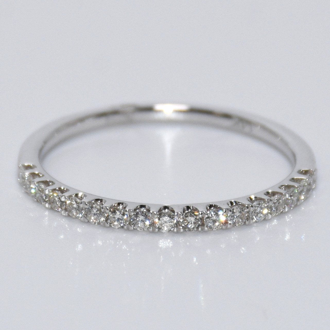 Diamond ring on a light gray background