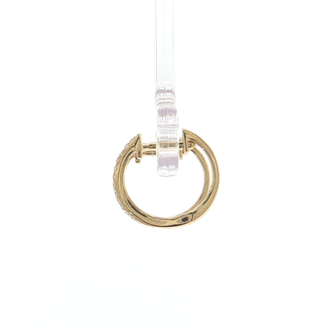 A gold-toned metal ring pendant with a textured finish, suspended from a clear plastic display pin against a solid white background.