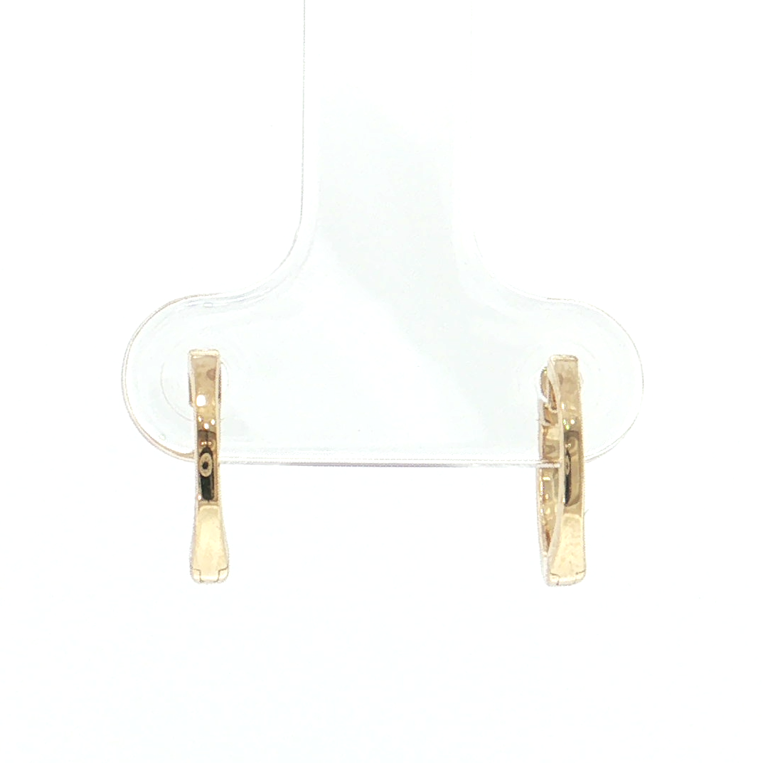 A pair of small gold hoop earrings displayed on a clear plastic jewelry stand against a plain white background.
