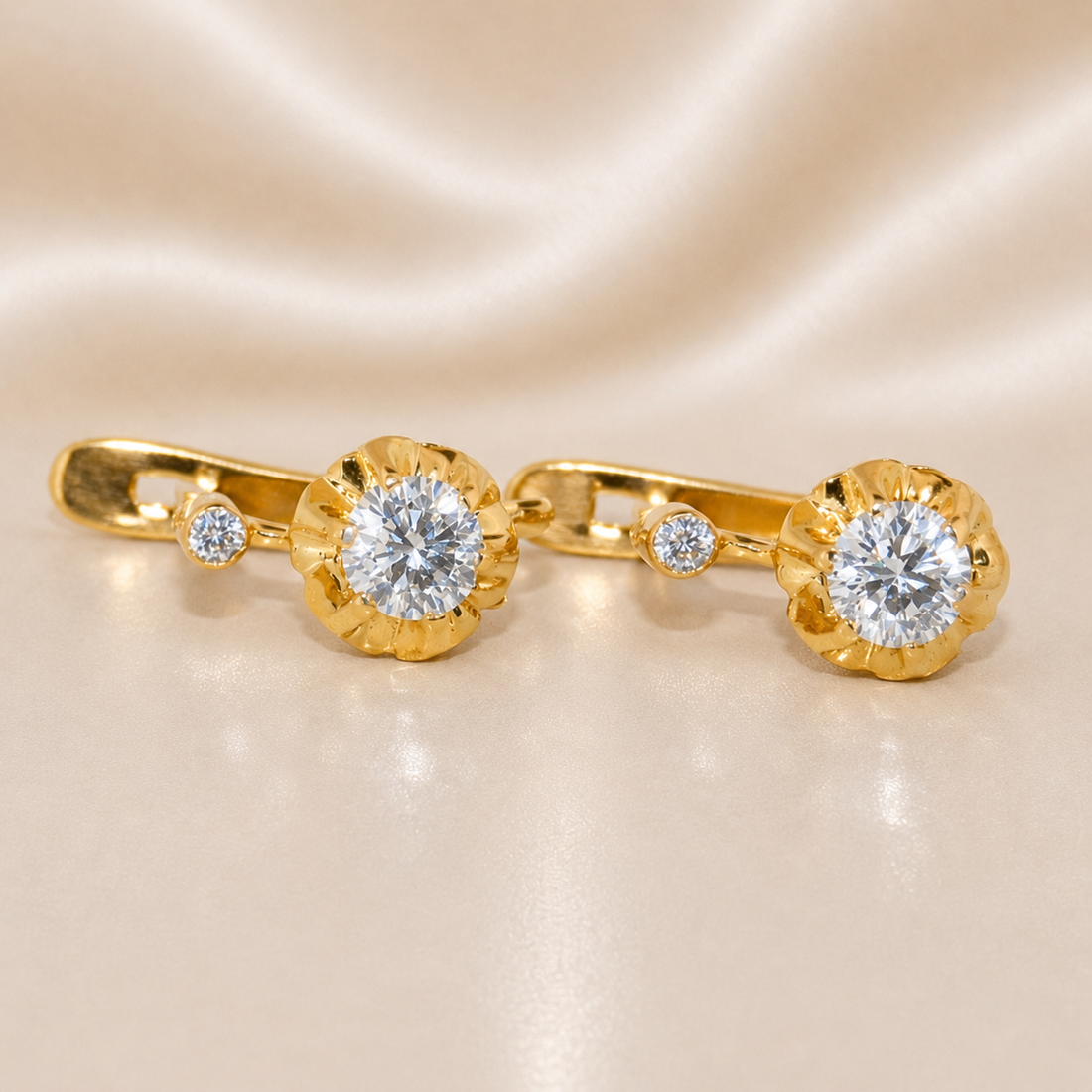 Gold earrings with diamond-like stones on a beige fabric background 19.2K Portuguese Gold | Dangle 2 Stone CZ Earrings