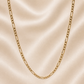 Gold chain necklace on a beige fabric background 19.2K Portuguese Gold | 20" Solid Figaro Chains