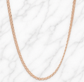 19.2K Portuguese Gold | 22" 2.5mm Freeze Chain Rose gold chain necklace on a white marble background