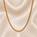 Gold chain necklace on a beige fabric background 19.2K Portuguese Gold | 24" 3mm Hollow Freeze Chain