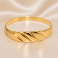 Gold bracelet on a satin surface 19.2K Portuguese Gold | Thin Shrimp Style Ring