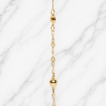 19.2K Portuguese Gold 6" Kids Heart twist bracelet with heart-shaped beads on a marble background
