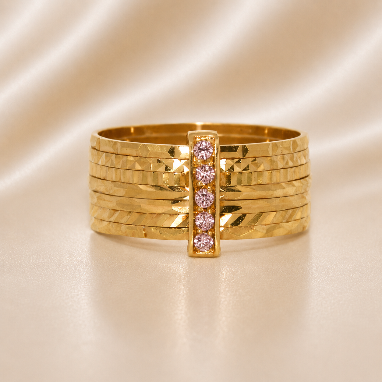 Gold bracelet with pink gemstones on a beige satin background 19.2K Portuguese Gold | CZ 7 Band Ring ( 7 Aliancas ) Pink Stones 