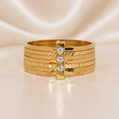 Gold bracelet with diamond accents on a beige background19.2K Portuguese Gold | CZ 7 Band Ring ( 7 Aliancas ) CZ Stone s 