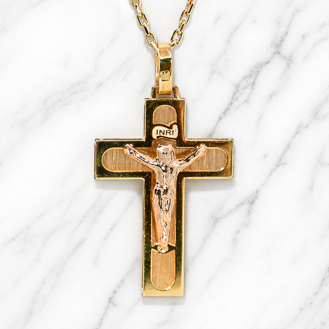
19.2K Portuguese Gold | Detailed Inri Crucifix Pendant
 Gold crucifix pendant on a marble background