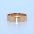Gold ring on a light blue background