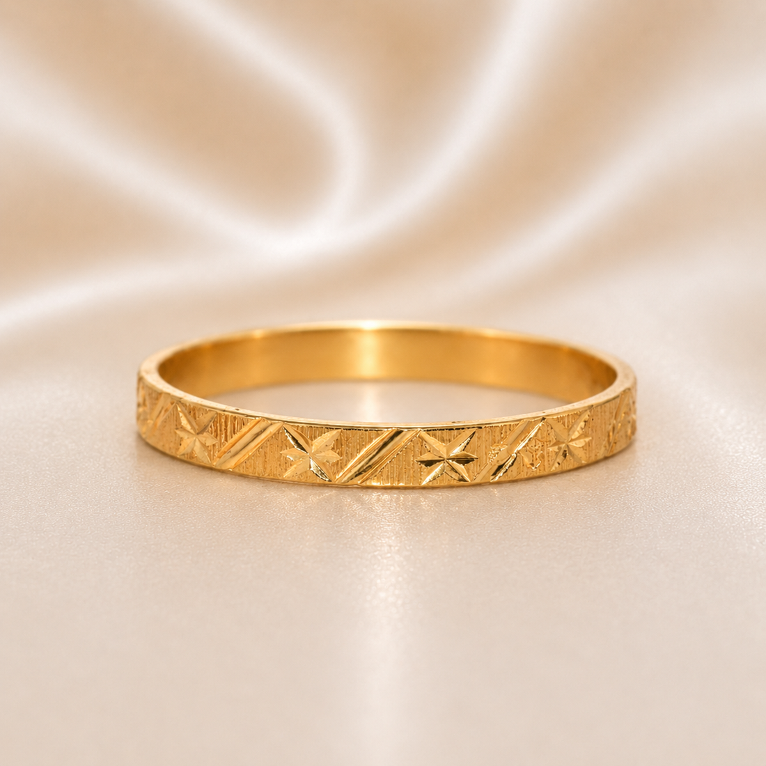 Gold bracelet with intricate patterns on a beige fabric background 19.2K Portuguese Gold | Geometric Star Pattern 2.6mm