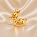 Gold duck-shaped pendant on a beige satin background 19.2K Portuguese Gold | Large Duck Charm 1 