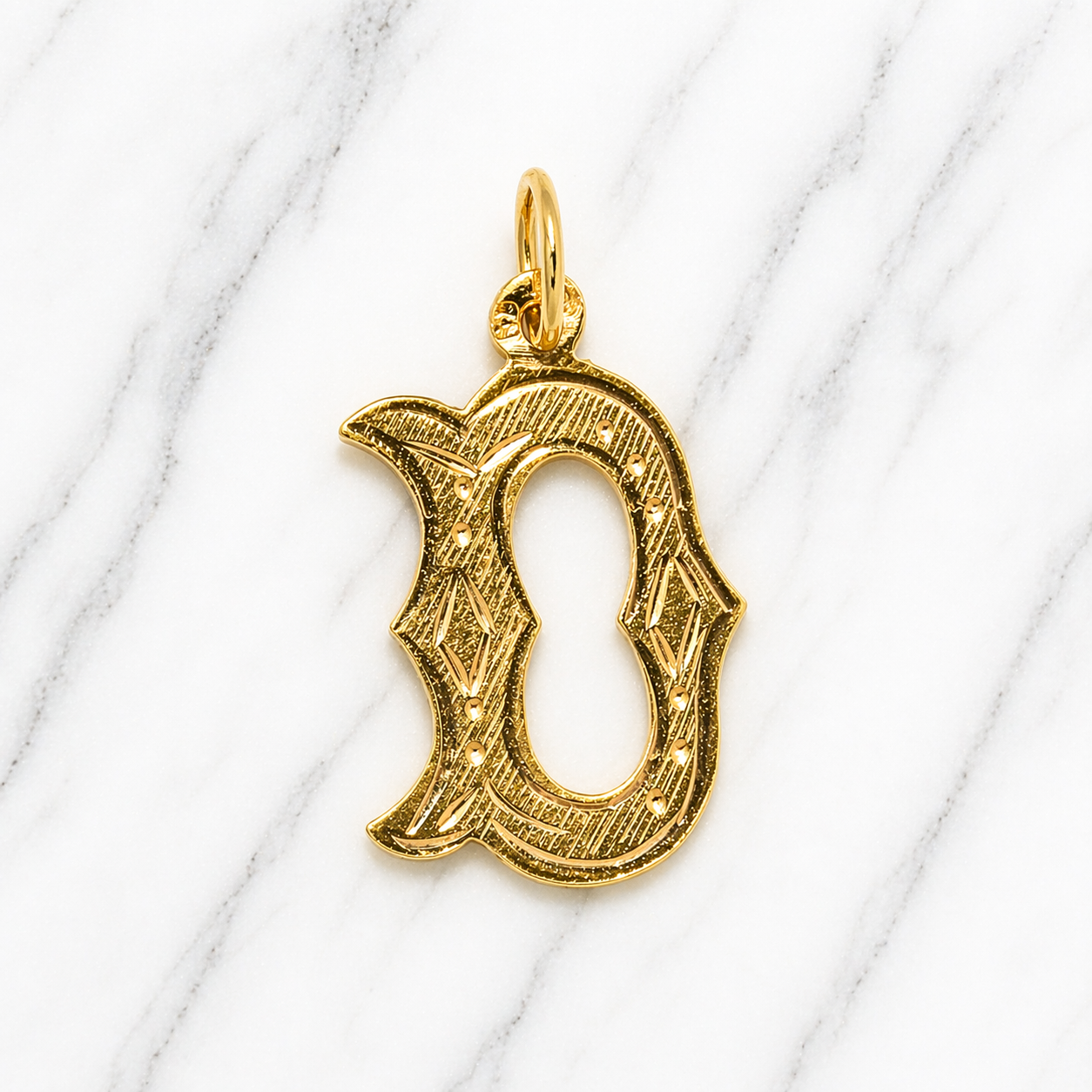 Gold pendant on a white marble background19.2K Portuguese Gold | Large Initial Charm Letter Pendants Letter Initial D 