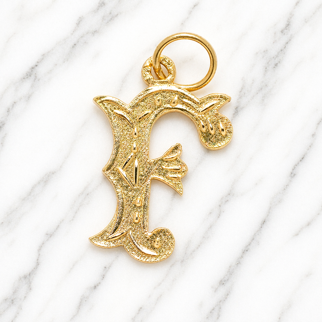 Gold letter 'F' pendant on a marble background 19.2K Portuguese Gold | Large Initial Charm Letter Pendants Letter F Initial Name Charm 