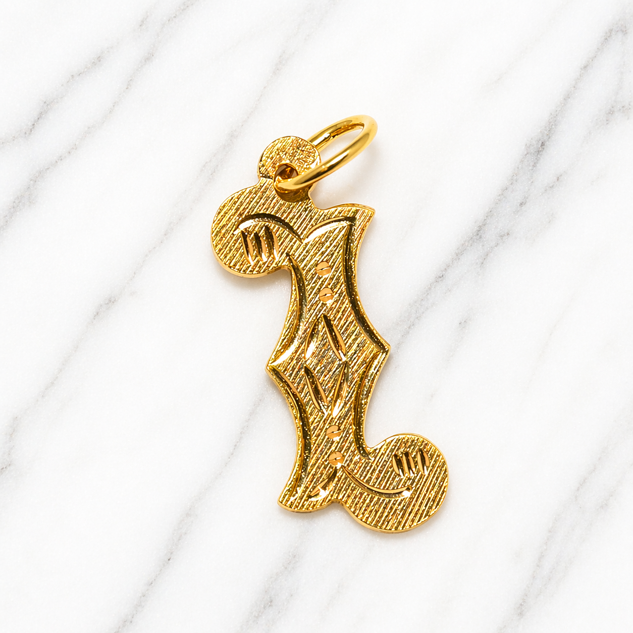 Gold pendant with a unique design on a white marble surface 19.2K Portuguese Gold | Large Initial Charm Letter Pendants With Letter I Initial Letter 