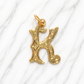Gold letter 'K' pendant on a white marble background 19.2K Portuguese Gold | Large Initial Charm Letter Pendants Letter K Name 