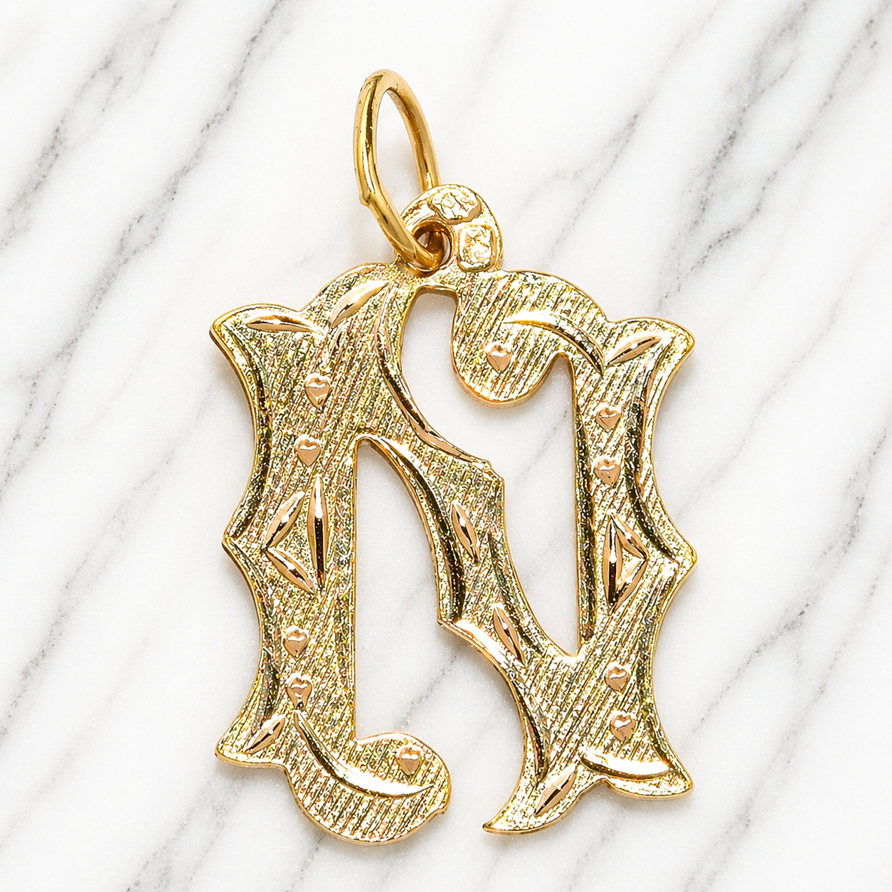 Gold pendant shaped like the letter 'N' on a marble background 19.2K Portuguese Gold | Large Initial Charm Letter Pendants