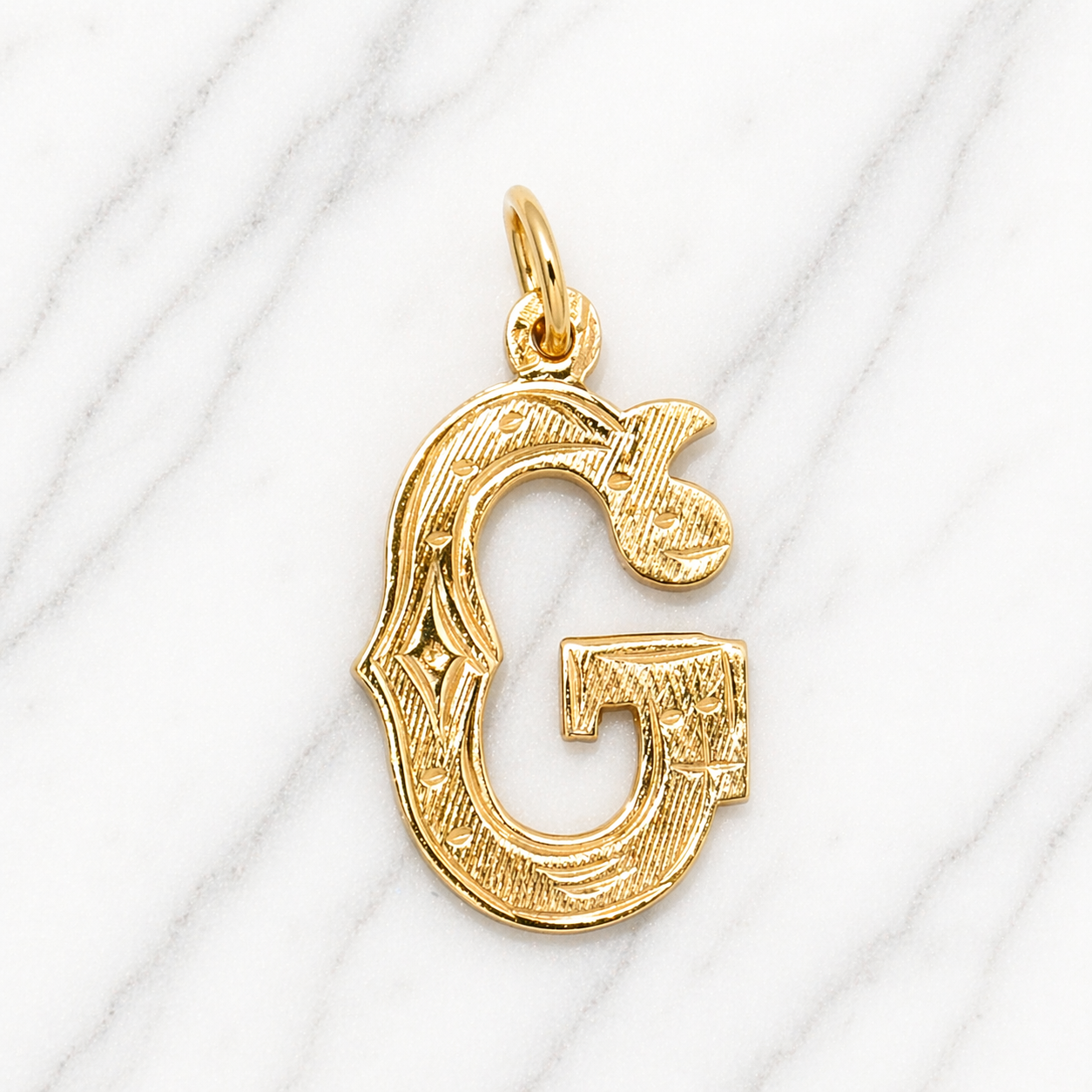 Gold letter 'G' pendant on a white background 19.2K Portuguese Gold | Medium Initial Charms Letter G Initial 