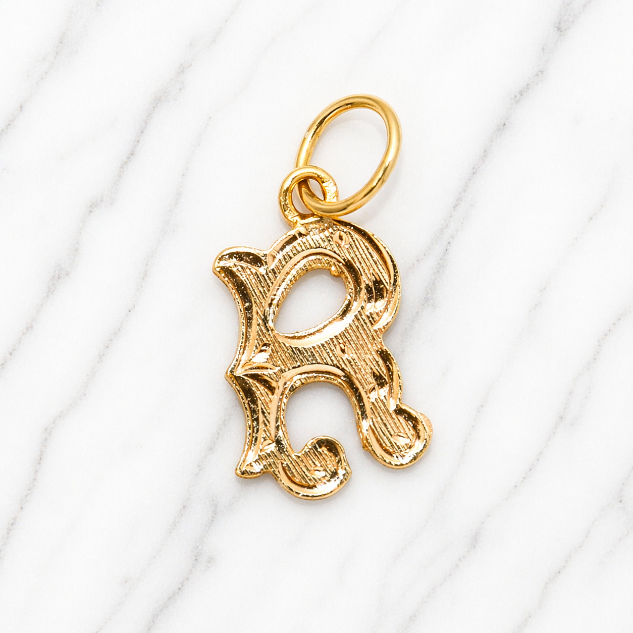Gold letter 'R' pendant on a white background 19.2K Portuguese Gold | Medium Initial Charms Initial charms 
