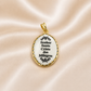 Gold pendant with white engraved text on a beige satin background 19.2K Portuguese Gold | Porcelain Bezel Saint Christ ( Santo Cristo ) Pendant