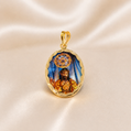 Gold pendant with a religious scene on a beige fabric background 19.2K Portuguese Gold | Porcelain Bezel Saint Christ ( Santo Cristo ) Pendant Vintage 