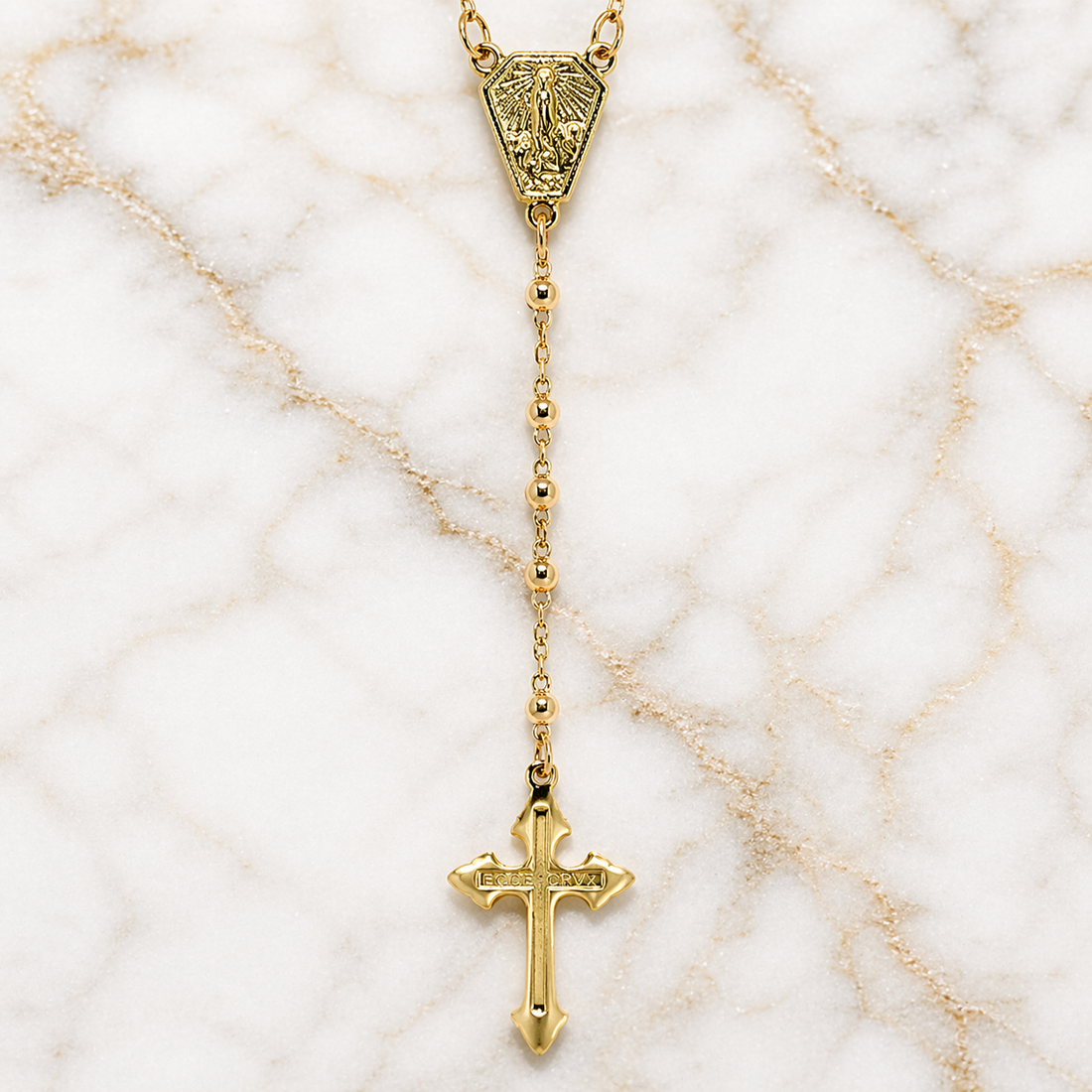 Gold necklace with a cross pendant on a marble background 19.2K Portuguese Gold | Rosary Necklaces 17 Inch