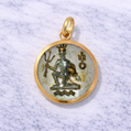 19.2K Portuguese Gold pendant with a detailed aquarius design on a textured white background