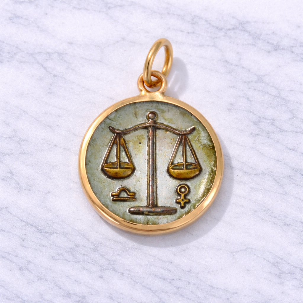 19.2K Portuguese Gold pendant with Libra zodiac symbol on a light gray background