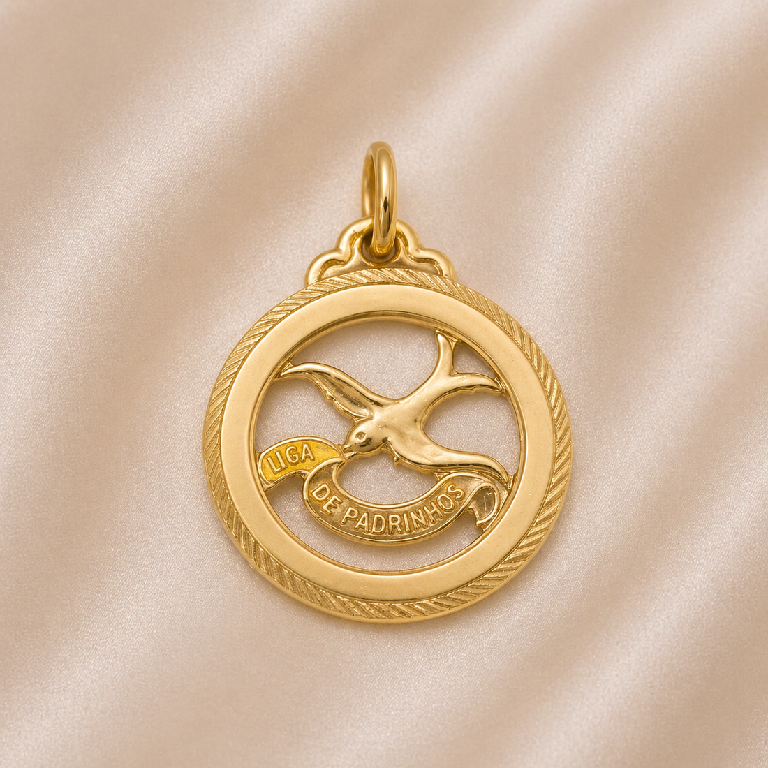 Gold pendant with a bird design on a beige fabric background 19.2K Portuguese Gold | Round Cutout Lca De Padrinhos Charm