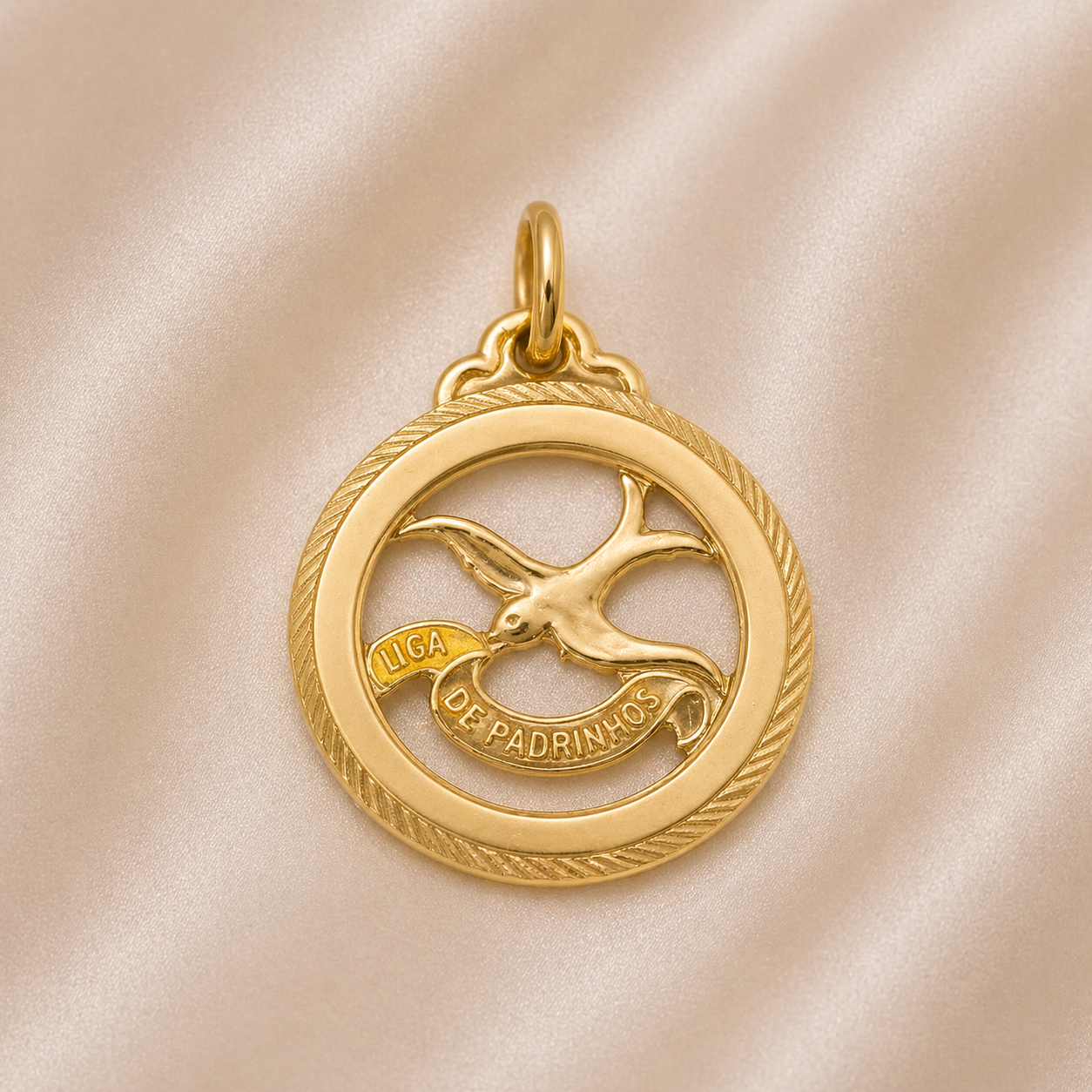 Gold pendant with a bird design on a beige fabric background 19.2K Portuguese Gold | Round Cutout Lca De Padrinhos Charm