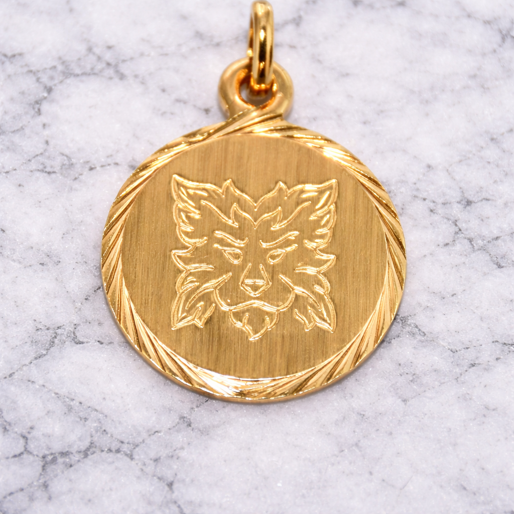 19.2K Portuguese Gold pendant with a leo zodiac lion wolf design on a marble background