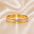 Gold ring with textured band on a beige fabric background 19.2K Portuguese Gold | Rounded Diamond Cut