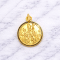 19.2K Portuguese Gold pendant with religious design on a marble background