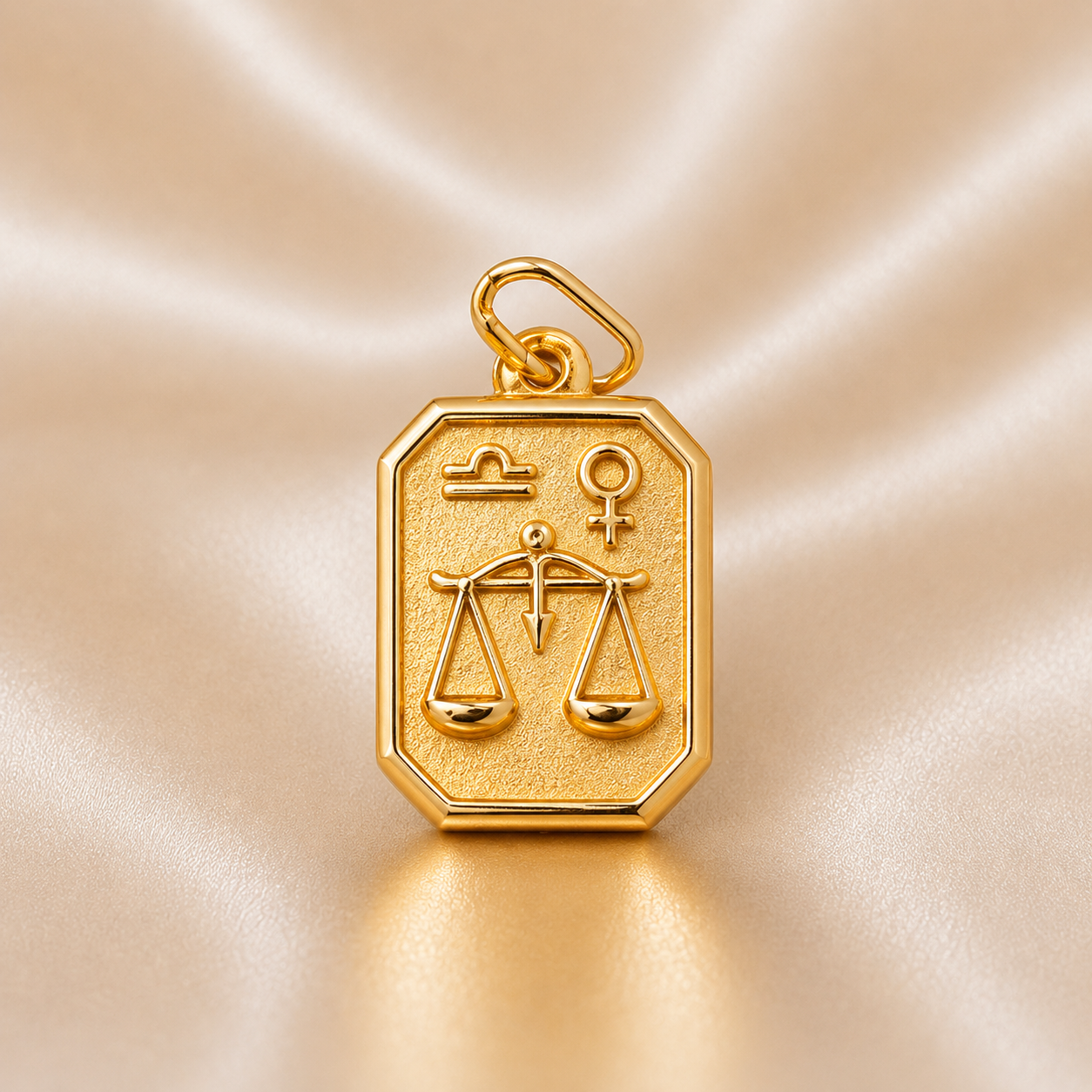 Gold pendant with Libra zodiac symbol on a beige satin background 19.2K Portuguese Gold | Square Zodiac Charms