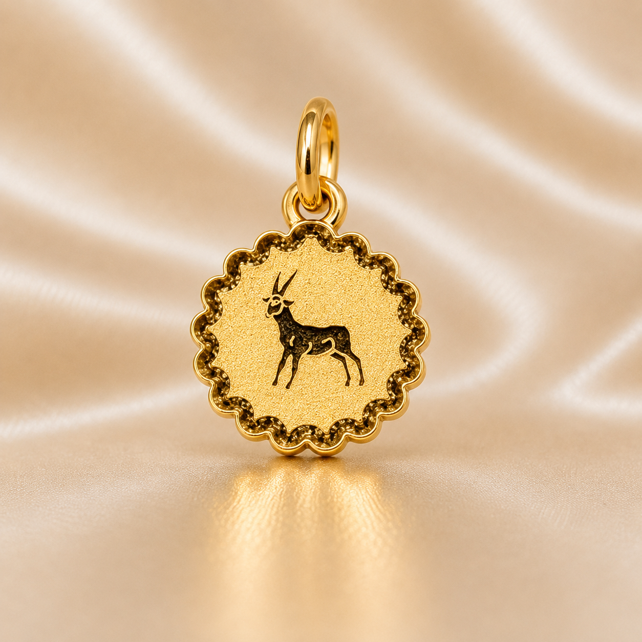 Gold pendant with a deer design on a beige satin background 19.2K Portuguese Gold | Sunburst Zodiac Charms Capricorn Sign