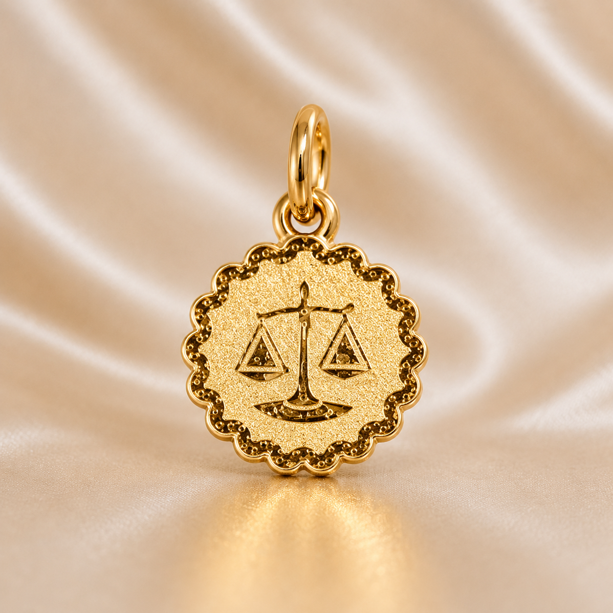 Gold pendant with a scale design on a beige satin background 19.2K Portuguese Gold | Sunburst Zodiac Charms Libra Sign-d818-4d81-a4a2-1723879bc66e