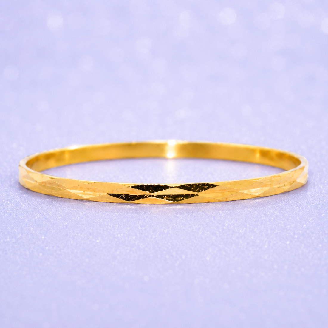 Gold bangle on a light purple background 19.2K Portuguese Gold | Thin Geometric Design Wedding Bands diamond cut