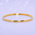 Gold bracelet on a light purple background19.2K Portuguese Gold | Thin Geometric Design Wedding Bands zig zag cut