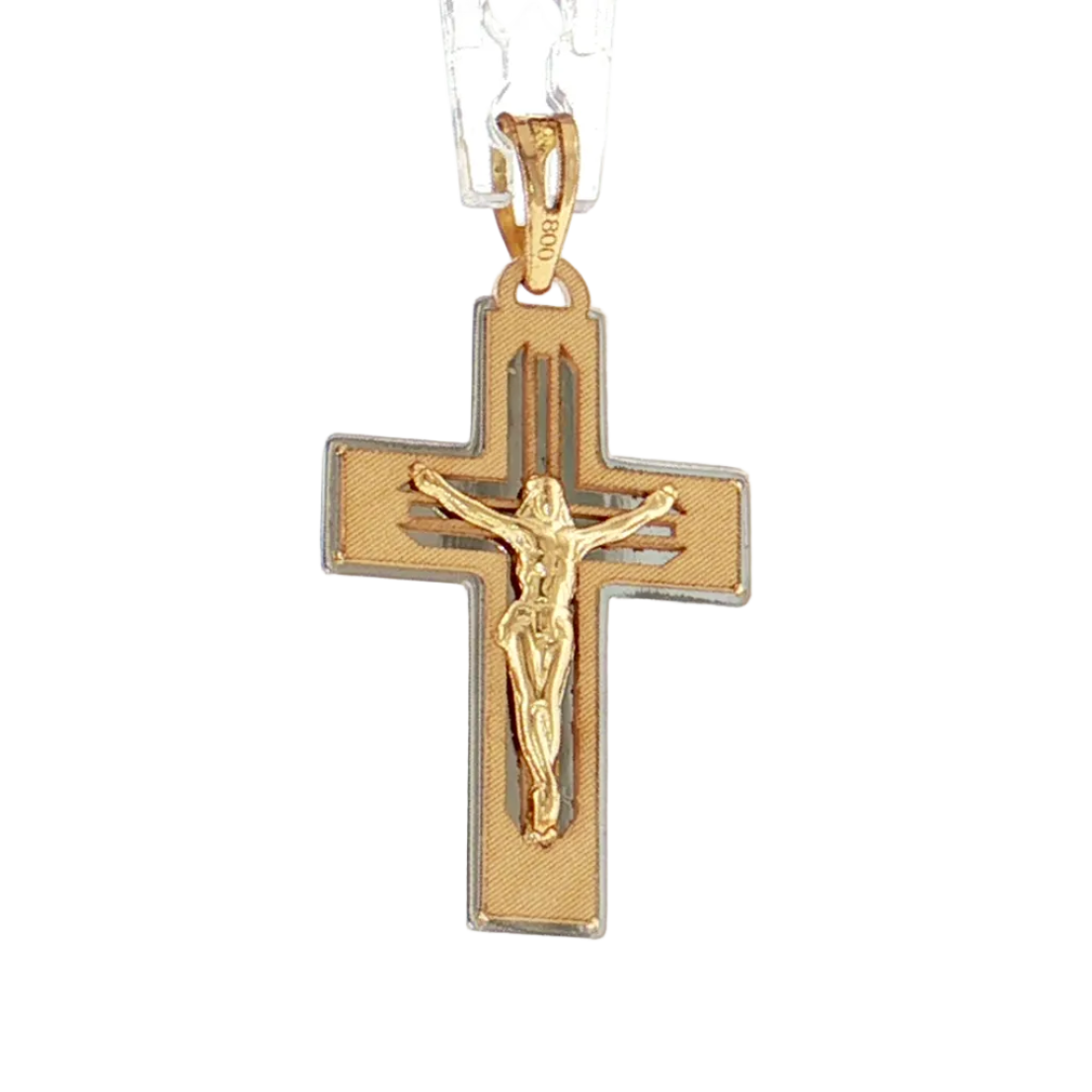 A gold crucifix pendant necklace with a raised figure of Jesus on a textured gold cross, suspended from a clear chain against a white background.