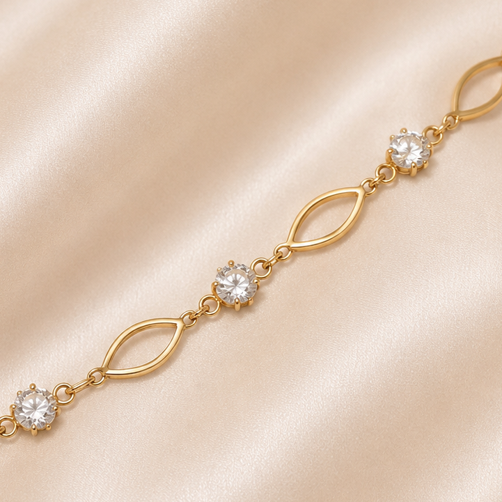 Gold bracelet with clear stones on a beige satin background 19.2K Portuguese Gold | YG Oval Link & CZ Bracelet
