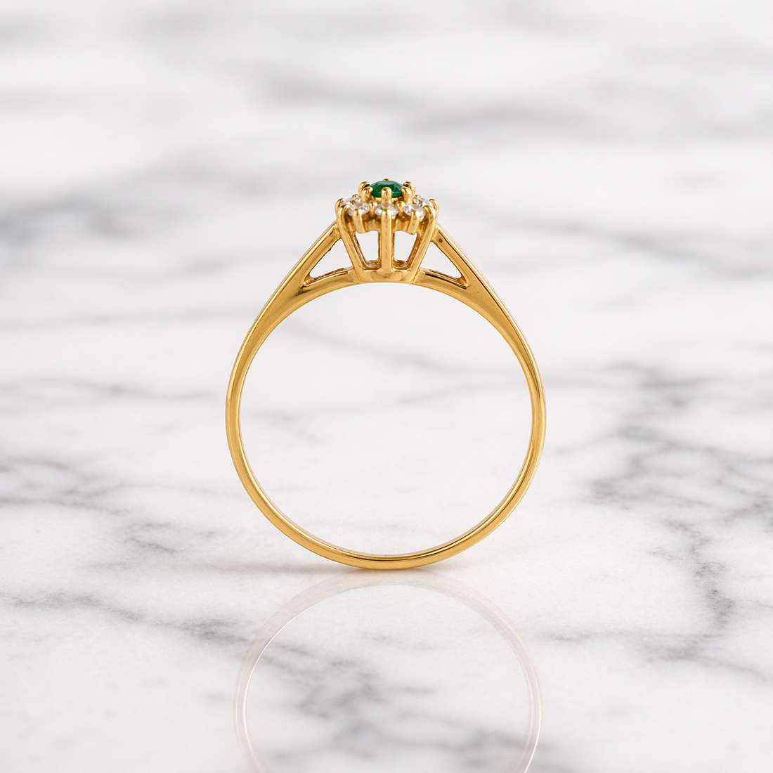 Simple solitaire band with a cluster of CZ's and a green stone