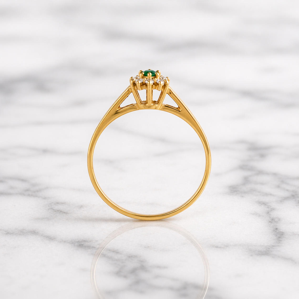 Simple solitaire band with a cluster of CZ's and a green stone