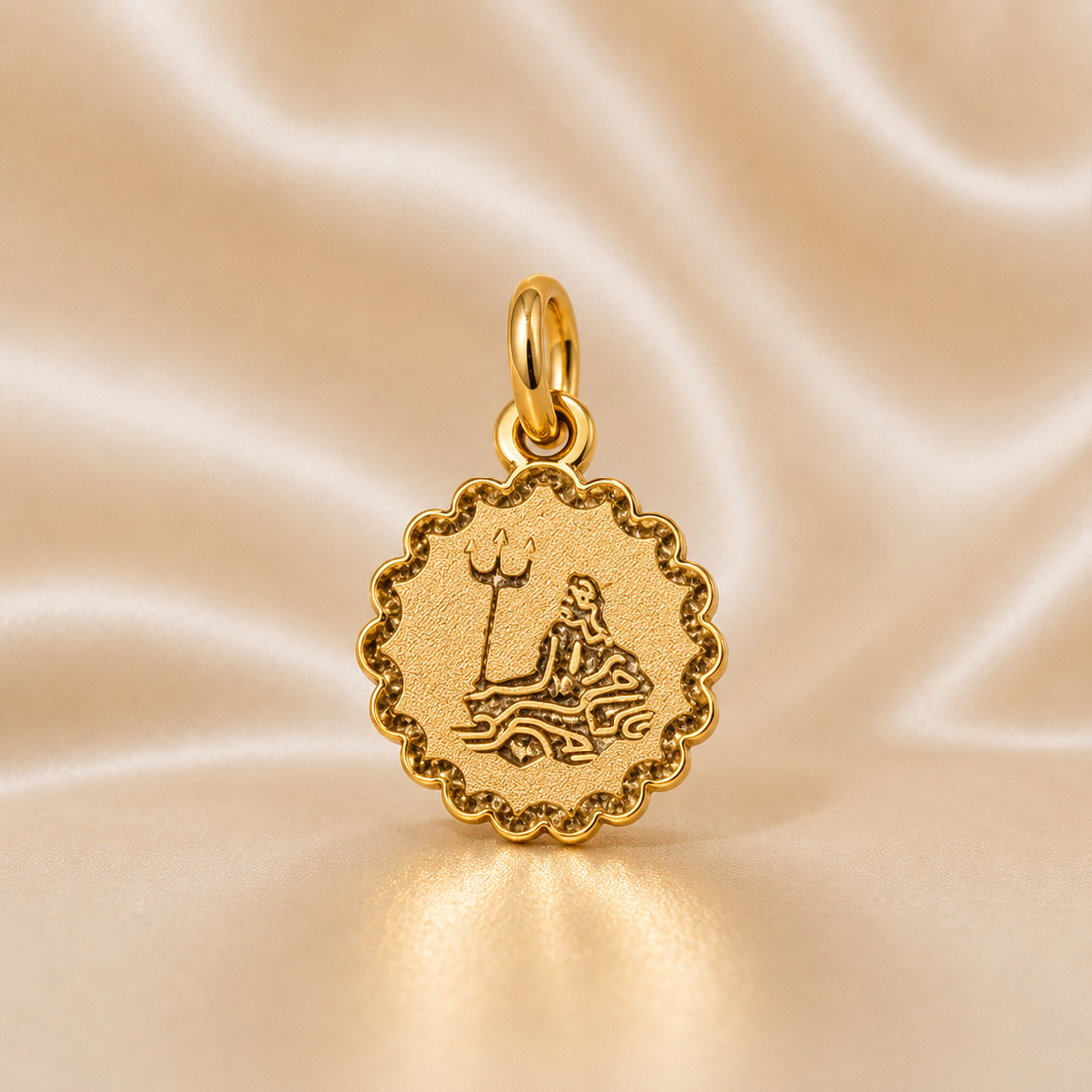 Gold pendant with a detailed design on a beige satin background 19.2K Portuguese Gold | Sunburst Zodiac Charms Aquarius