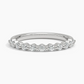 Silver ring with small diamonds on a white background