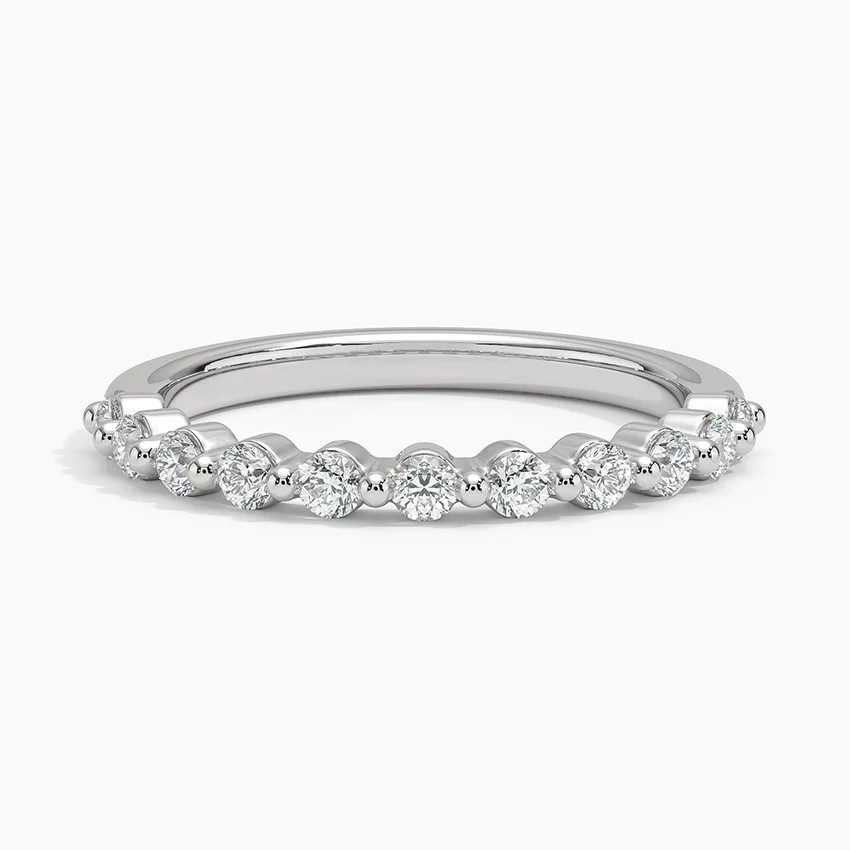 Silver ring with small diamonds on a white background
